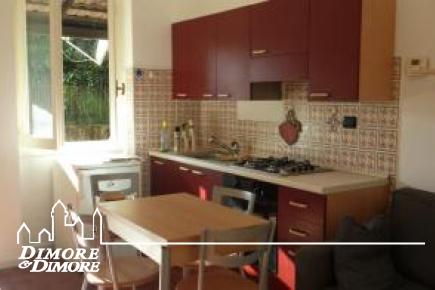 Two-room apartment in Ghiffa with garden hills.